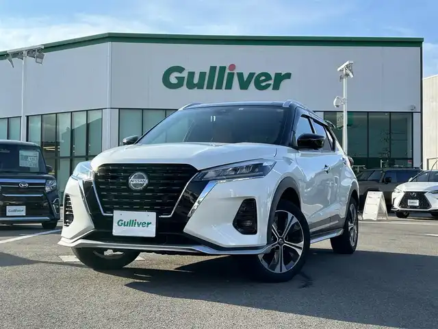 日産 キックス X ツートーンインテリアED 愛媛県 2021(令3)年 5万km ブリリアントホワイトパール/ピュアブラック 2トーン 登録時走行距離：49564Km/純正メーカーOPメモリナビ/ビルトインETC/追従クルコン/EVモード/横滑り防止装置/盗難防止装置/衝突軽減システム/前後コーナーセンサー/前後ドラレコ/LEDヘッドライト/オートライト/オートハイビーム/フォグランプ/エンジンスタートボタン/ツートン革シート/シートヒーター/ハンドルヒーター/スマートキー/スペアキー一本/純正アルミホイール/エアロ