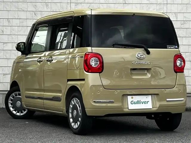 ダイハツ ムーヴ キャンバス セオリー G 大分県 2023(令5)年 0.6万km サンドベージュメタリック 純正SDナビ（NMZL-W73D）/Bluetooth/TV/CD/DVD/パワースライドドア（両側）/シートヒーター（D＋N席）/コーナーセンサー（前後）/オートブレーキホールド/アイドリングストップ/保温機能付きカップホルダー/電動格納ミラー/バックカメラ/USB・HDMI入力端子/ステアリングスイッチ/ベンチシート/スペアキー/純正フロアマット/革巻ステアリング/革巻シフトノブ/ドライブレコーダー/LED/ETC