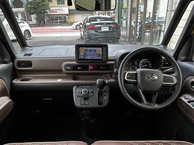 ダイハツ ムーヴ キャンバス セオリー G 大分県 2023(令5)年 0.6万km サンドベージュメタリック 純正SDナビ（NMZL-W73D）/Bluetooth/TV/CD/DVD/パワースライドドア（両側）/シートヒーター（D＋N席）/コーナーセンサー（前後）/オートブレーキホールド/アイドリングストップ/保温機能付きカップホルダー/電動格納ミラー/バックカメラ/USB・HDMI入力端子/ステアリングスイッチ/ベンチシート/スペアキー/純正フロアマット/革巻ステアリング/革巻シフトノブ/ドライブレコーダー/LED/ETC