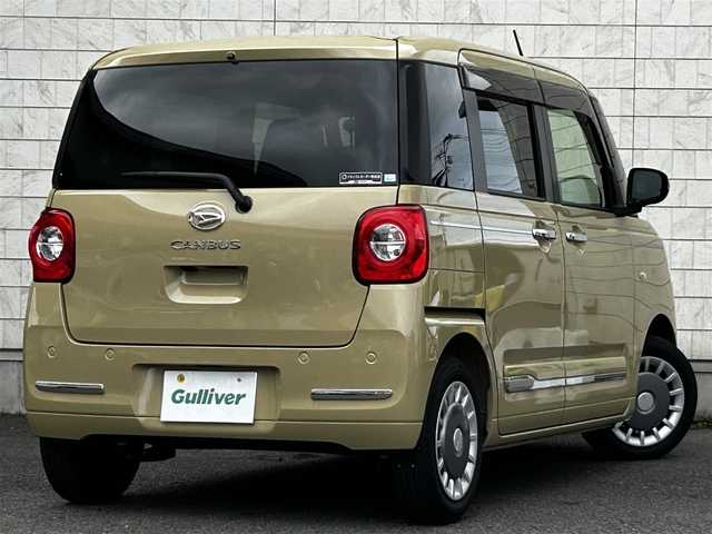 ダイハツ ムーヴ キャンバス セオリー G 大分県 2023(令5)年 0.6万km サンドベージュメタリック 純正SDナビ（NMZL-W73D）/Bluetooth/TV/CD/DVD/パワースライドドア（両側）/シートヒーター（D＋N席）/コーナーセンサー（前後）/オートブレーキホールド/アイドリングストップ/保温機能付きカップホルダー/電動格納ミラー/バックカメラ/USB・HDMI入力端子/ステアリングスイッチ/ベンチシート/スペアキー/純正フロアマット/革巻ステアリング/革巻シフトノブ/ドライブレコーダー/LED/ETC