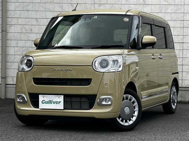 ダイハツ ムーヴ キャンバス セオリー G 大分県 2023(令5)年 0.6万km サンドベージュメタリック 純正SDナビ（NMZL-W73D）/Bluetooth/TV/CD/DVD/パワースライドドア（両側）/シートヒーター（D＋N席）/コーナーセンサー（前後）/オートブレーキホールド/アイドリングストップ/保温機能付きカップホルダー/電動格納ミラー/バックカメラ/USB・HDMI入力端子/ステアリングスイッチ/ベンチシート/スペアキー/純正フロアマット/革巻ステアリング/革巻シフトノブ/ドライブレコーダー/LED/ETC