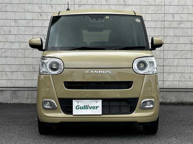 ダイハツ ムーヴ キャンバス セオリー G 大分県 2023(令5)年 0.6万km サンドベージュメタリック 純正SDナビ（NMZL-W73D）/Bluetooth/TV/CD/DVD/パワースライドドア（両側）/シートヒーター（D＋N席）/コーナーセンサー（前後）/オートブレーキホールド/アイドリングストップ/保温機能付きカップホルダー/電動格納ミラー/バックカメラ/USB・HDMI入力端子/ステアリングスイッチ/ベンチシート/スペアキー/純正フロアマット/革巻ステアリング/革巻シフトノブ/ドライブレコーダー/LED/ETC