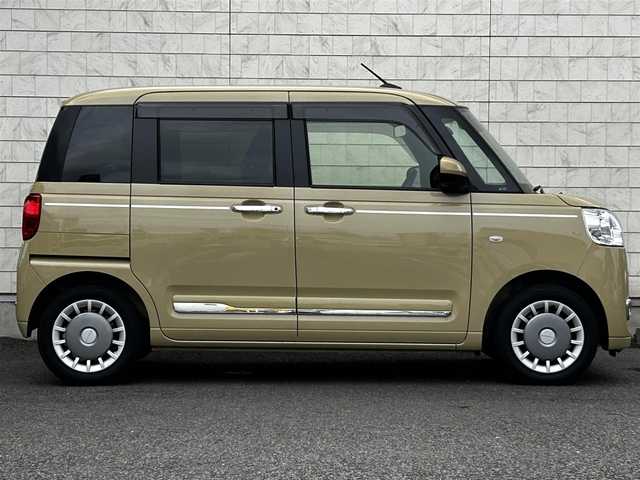 ダイハツ ムーヴ キャンバス セオリー G 大分県 2023(令5)年 0.6万km サンドベージュメタリック 純正SDナビ（NMZL-W73D）/Bluetooth/TV/CD/DVD/パワースライドドア（両側）/シートヒーター（D＋N席）/コーナーセンサー（前後）/オートブレーキホールド/アイドリングストップ/保温機能付きカップホルダー/電動格納ミラー/バックカメラ/USB・HDMI入力端子/ステアリングスイッチ/ベンチシート/スペアキー/純正フロアマット/革巻ステアリング/革巻シフトノブ/ドライブレコーダー/LED/ETC