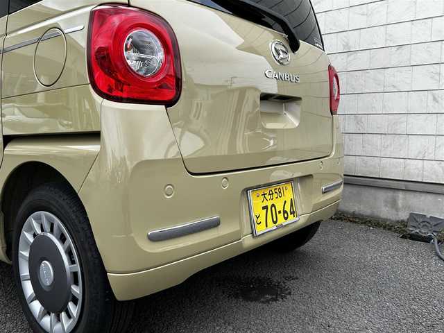 ダイハツ ムーヴ キャンバス セオリー G 大分県 2023(令5)年 0.6万km サンドベージュメタリック 純正SDナビ（NMZL-W73D）/Bluetooth/TV/CD/DVD/パワースライドドア（両側）/シートヒーター（D＋N席）/コーナーセンサー（前後）/オートブレーキホールド/アイドリングストップ/保温機能付きカップホルダー/電動格納ミラー/バックカメラ/USB・HDMI入力端子/ステアリングスイッチ/ベンチシート/スペアキー/純正フロアマット/革巻ステアリング/革巻シフトノブ/ドライブレコーダー/LED/ETC