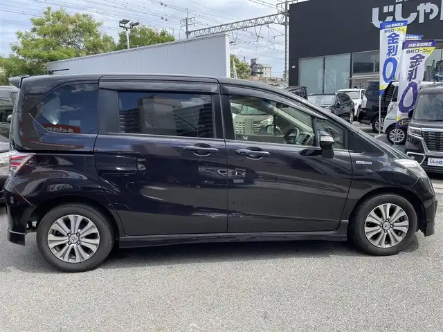 ホンダ フリード スパイク ハイブリット ジャストセレクション 兵庫県 2012(平24)年 8.2万km プレミアムブラキッシュパール (株)IDOMが運営する【じしゃロン西宮店】の自社ローン専用車両になります。こちらは現金またはオートローンご利用時の価格です。自社ローンご希望の方は別途その旨お申付け下さい/＊ETC/＊バックカメラ/＊パワステ/＊パワーウィンドウ/＊クルーズコントロールあり/＊フルセグ/＊両側パワスラ/＊ハーフレザー/＊横滑り防止装置/＊オートライト