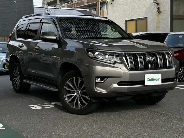 トヨタ ランドクルーザー プラド TZ－G 福岡県 2021(令3)年 3.5万km アバンギャルドブロンズメタリック ワンオーナー/純正ナビ/AM/FM/USB/ミラーキャスト/Bluetooth/クルーズコントロール/レーンキープ/パドルシフト/ハンズフリー/オートライト/オートマチックハイビーム/電動格納ミラー/横滑り/ライトウォッシャー/MTSモード/CRAWLモード/ECOモード/パワーシート（D/N)/シートメモリー（D)/パーキングアシスト/ビルドETC2.0/ドライブレコーダー（前後、SDカード有）/純正アルミホイール/社外フロアマット/保証書/取扱説明書/スペアキー×１
