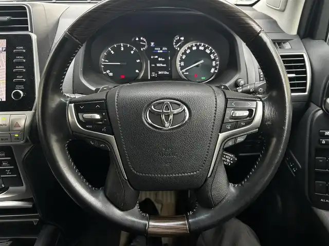 トヨタ ランドクルーザー プラド TZ－G 福岡県 2021(令3)年 3.5万km アバンギャルドブロンズメタリック ワンオーナー/純正ナビ/AM/FM/USB/ミラーキャスト/Bluetooth/クルーズコントロール/レーンキープ/パドルシフト/ハンズフリー/オートライト/オートマチックハイビーム/電動格納ミラー/横滑り/ライトウォッシャー/MTSモード/CRAWLモード/ECOモード/パワーシート（D/N)/シートメモリー（D)/パーキングアシスト/ビルドETC2.0/ドライブレコーダー（前後、SDカード有）/純正アルミホイール/社外フロアマット/保証書/取扱説明書/スペアキー×１