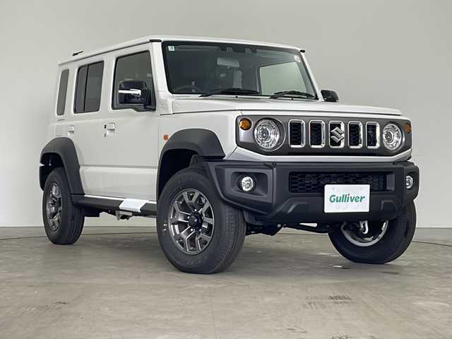スズキ ジムニー ノマド FC 秋田県 2025(令7)年 0.1万km未満 アークティックホワイトパール 4WD/ワンオーナー/スズキセーフティサポート/レーダークルーズコントロール/ダウンヒルアシストコントロール/アイドリングストップ/コーナーセンサー/横滑り防止装置/本革ステアリング/ステアリングリモコン/ヘッドライトウォッシャー/LEDヘッドランプ/フォグランプ/前席シートヒーター/ドアミラーヒーター/保証書・取説