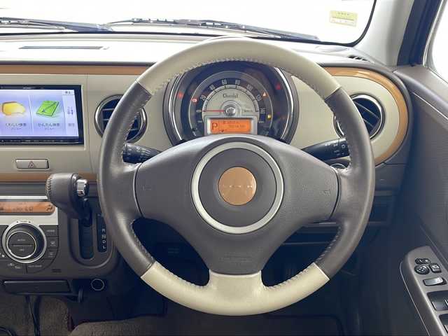 スズキ ラパン ショコラ X 沖縄県 2014(平26)年 9.6万km フェニックスレッドパール 県外仕入れ車両																							社外メモリナビ(NR-MZ03)/（CD/DVD/SD/Bluetooth接続/フルセグTV）/アイドリングストップ/レザーシート/HIDヘッドライト/オートライト/純正フロアマット/電動格納ウィンカーミラー/プッシュスタート/スマートキー/取扱説明書