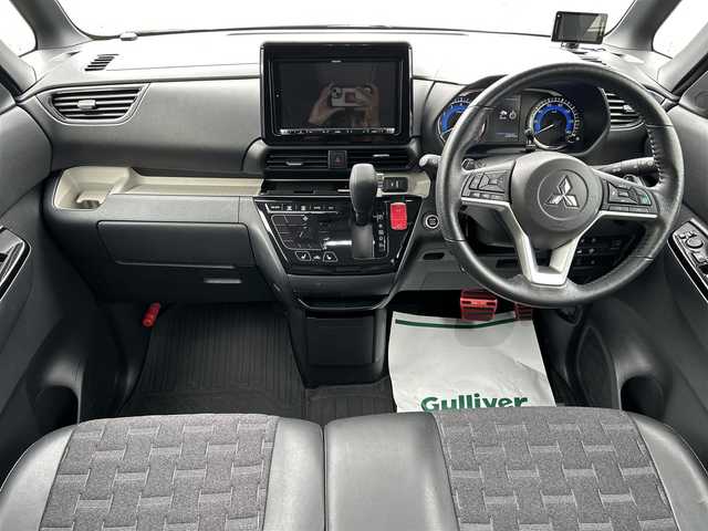 三菱 デリカミニ T プレミアム 兵庫県 2023(令5)年 2.3万km ＤグリーンⅡ ワンオーナー/社外9インチナビ/フルセグテレビ/BTオーディオ/CD/DVD再生機能/全方位カメラ/デジタルインナーミラー/ワイヤレス充電/前席シートヒーター/ステアリングヒーター/両側パワースライドドア/ETC2.0/パドルシフト/LEDヘッドライト/純正15インチAW