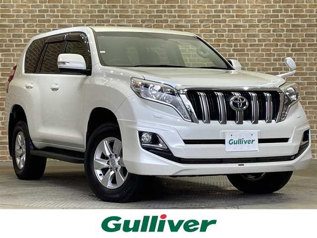 トヨタ ランドクルーザー プラド TX 岩手県 2015(平27)年 8万km ホワイトパールクリスタルシャイン ４WD/モデリスタフロントスポイラー/ディーゼルターボ/センターデフロック/ダウンヒルアシスト/MTモード付AT/横滑り防止装置/ストラーダナビ/フルセグTV/バックカメラ/ドライブレコーダー/ETC/ヘッドライトウォッシャー/トノカバー/オートライト/LEDヘッドランプ/フォグランプ/純正１７インチアルミホイール/純正フロアマット