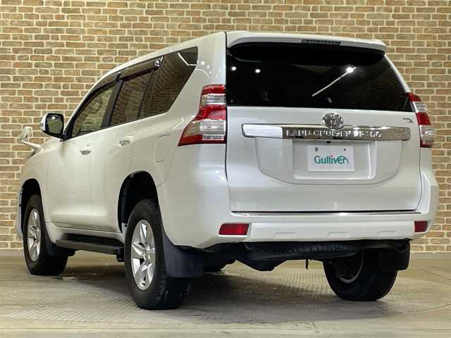 トヨタ ランドクルーザー プラド TX 岩手県 2015(平27)年 8万km ホワイトパールクリスタルシャイン ４WD/モデリスタフロントスポイラー/ディーゼルターボ/センターデフロック/ダウンヒルアシスト/MTモード付AT/横滑り防止装置/ストラーダナビ/フルセグTV/バックカメラ/ドライブレコーダー/ETC/ヘッドライトウォッシャー/トノカバー/オートライト/LEDヘッドランプ/フォグランプ/純正１７インチアルミホイール/純正フロアマット