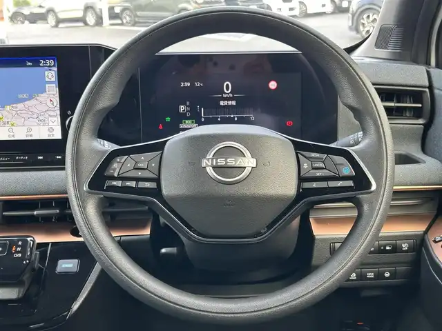 日産 サクラ G 島根県 2023(令5)年 0.4万km ホワイトパール 登録時走行距離3737km/ワンオーナー/純正ナビ(Bluetooth・AM・FM)/フルセグTV/全周囲カメラ/プロパイロット/レーダークルーズコントロール/前後コーナーセンサー/ETC2.0/シートヒーター(運転席・助手席)/ハンドルヒーター/オートライト/LEDヘッドライト/フォグランプ/純正14インチAW/純正フロアマット/スマートキー(スペアキー×1)/禁煙車