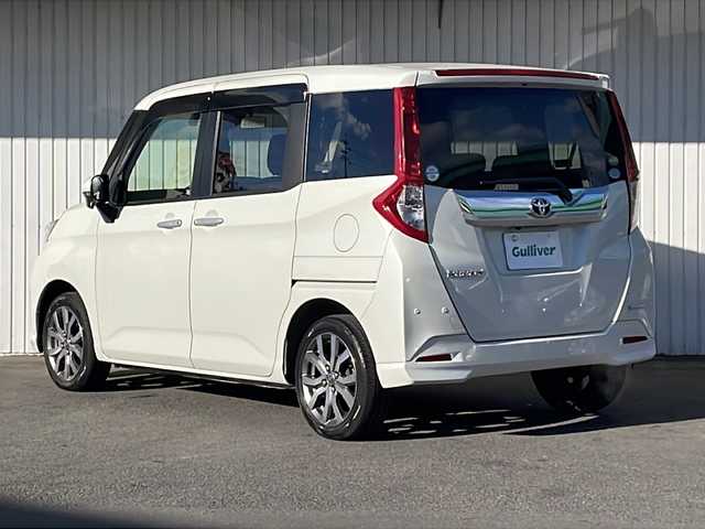 トヨタ ルーミー カスタムG－T 静岡県 2019(令1)年 2.2万km パールホワイトⅢ ９インチＳＤナビ（NSZT-Y68T）/CD/DVD/SD/Bluetooth/フルセグ/バックモニター/純正ビルトインETC/前方ドライブレコーダー/追従型クルーズコントロ―ル/レーンキープアシスト/前後コーナーセンサー/盗難防止装置/前席シートヒーター/両側パワースライドドア/純正LEDヘッドライト/フォグランプ/オートマチックハイビーム/衝突被害軽減システム/横滑り防止機能/純正15インチAW/純正ドアバイザー/純正フロアマット/取扱説明書/保証書