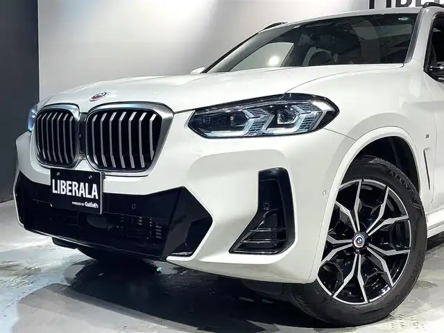ＢＭＷ Ｘ３ xDrive20d Mスポーツ 道央・札幌 2022(令4)年 4.1万km アルピンホワイトⅢ 電動パノラマ・ガラス・サンルーフ/ドライビング・アシスト・プロフェッショナル/・高速道路渋滞ハンズ・オフ・アシスト/・トラフィック・サイン・アシスト（速度制限認識）/・ACC/・ステアリング＆レーン・コントロール・アシスト/・レーン・ディパーチャー・ウォーニング/（車線逸脱警告システム）/・レーン・チェンジ・アシスト/・レーン・キーピング・アシスト/・クロス・トラフィック・ウォーニング/・クロスロード・ウォーニング/・前車接近警告機能/・後車衝突警告機能/・衝突回避・被害軽減ブレーキ/・エマージェンシー・ストップ・アシスト/パーキングアシストプラス/・PDC/・パーキングアシスト/・トップビュー＋３Dビュー/・サイドビューカメラ/・リアビューカメラ（予想進路表示機能付）/アダプティブLEDヘッドライト/電動フロントシート/運転席メモリー機能付/フロントシートヒーティング/リアシートヒーティング/BMWライブコックピット/・１２・３インチマルチディスプレイ・メーターパネル/・１２・３インチワイド・コントロール・ディスプレイ/・HDDナビ/オートマチックテールゲート/レインセンサー