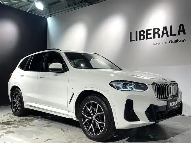ＢＭＷ Ｘ３ xDrive20d Mスポーツ 道央・札幌 2022(令4)年 4.1万km アルピンホワイトⅢ 電動パノラマ・ガラス・サンルーフ/ドライビング・アシスト・プロフェッショナル/・高速道路渋滞ハンズ・オフ・アシスト/・トラフィック・サイン・アシスト（速度制限認識）/・ACC/・ステアリング＆レーン・コントロール・アシスト/・レーン・ディパーチャー・ウォーニング/（車線逸脱警告システム）/・レーン・チェンジ・アシスト/・レーン・キーピング・アシスト/・クロス・トラフィック・ウォーニング/・クロスロード・ウォーニング/・前車接近警告機能/・後車衝突警告機能/・衝突回避・被害軽減ブレーキ/・エマージェンシー・ストップ・アシスト/パーキングアシストプラス/・PDC/・パーキングアシスト/・トップビュー＋３Dビュー/・サイドビューカメラ/・リアビューカメラ（予想進路表示機能付）/アダプティブLEDヘッドライト/電動フロントシート/運転席メモリー機能付/フロントシートヒーティング/リアシートヒーティング/BMWライブコックピット/・１２・３インチマルチディスプレイ・メーターパネル/・１２・３インチワイド・コントロール・ディスプレイ/・HDDナビ/オートマチックテールゲート/レインセンサー