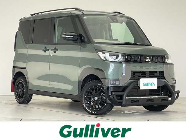 三菱 デリカミニ T プレミアム 愛知県 2024(令6)年 0.5万km ＤグリーンＭ マイパイロット/フロントバンパーガード/純正9型ナビ/全方位カメラ/両側パワースライドドア/クルーズコントロール/シートヒーター/ハンズフリースライドドア/バックカメラ/コーナーセンサー/アルミホイール/ルーフレール/LEDヘッドライト/パドルシフト/インテリジェントミラー/ステアリングヒーター/オートマチックハイビーム/ドライブレコーダー/ETC/衝突軽減システム/フルセグ/CD DVD/Bluetooth/ステアリングスイッチ/スマートキー/プッシュスタート