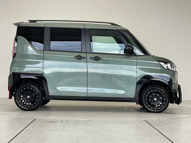 三菱 デリカミニ T プレミアム 愛知県 2024(令6)年 0.5万km ＤグリーンＭ マイパイロット/フロントバンパーガード/純正9型ナビ/全方位カメラ/両側パワースライドドア/クルーズコントロール/シートヒーター/ハンズフリースライドドア/バックカメラ/コーナーセンサー/アルミホイール/ルーフレール/LEDヘッドライト/パドルシフト/インテリジェントミラー/ステアリングヒーター/オートマチックハイビーム/ドライブレコーダー/ETC/衝突軽減システム/フルセグ/CD DVD/Bluetooth/ステアリングスイッチ/スマートキー/プッシュスタート