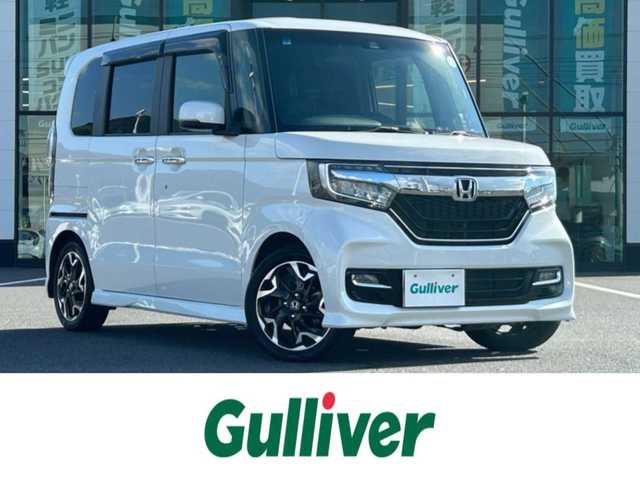ホンダ Ｎ ＢＯＸ カスタム G L ターボ ホンダセンシング 岡山県 2018(平30)年 6.7万km プラチナホワイトパール 登録時走行距離　66455km/禁煙車/純正ナビ(型番：VMX-194VFi)/　(CD/フルセグTV/Bluetooth)/デジタルインナーミラー/バックカメラ/クルーズコントロール(追従走行あり)/衝突被害軽減システム/車線逸脱警報（レーンキープアシスト）/ビルトインETC/両側パワースライドドア/ハーフレザーシート/革巻きステアリング/ステアリングスイッチ/純正LEDヘッドライト/フォグライト/オートライト/プッシュスタート/スマートキー/パドルシフト/アイドリングストップ/純正アルミホイール 15インチ/ドアバイザー/ロールサンシェード/ウインカーミラー/電動格納ミラー/オートリトラミラー/純正フロアマット/横滑防止装置/盗難防止装置/取扱説明書/ナビ取扱説明書/新車時整備手帳（保証書）