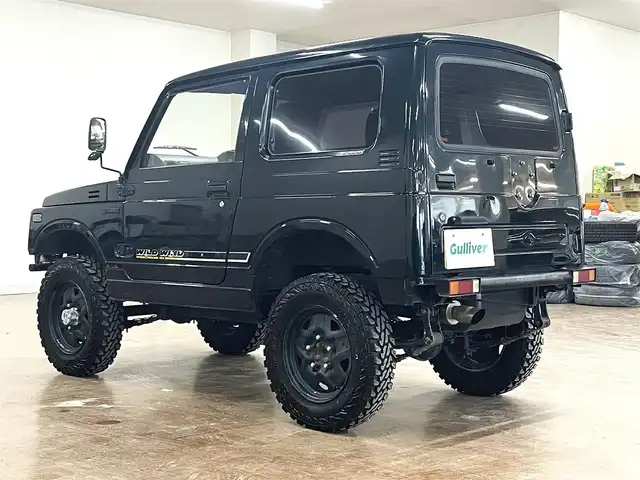 スズキ ジムニー ワイルドウィンド LTD 道央・札幌 1993(平5)年 18.3万km ダーククラシックジェイドパール 5MT/リフトアップ/マッドタイヤ/　GEOLANDAR　M/T　G003/　2025年製　9mm/前後パイプバンパー/社外マフラー（車検対応）/社外ヘッドライトレンズ/社外ウインカーレンズ（前/横）/社外フロントグリル/社外ステアリング/社外シートカバー/ナンバー移動キット/社外オーディオ/　CD/AUX/USB/FM/AM