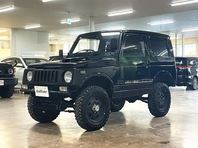 スズキ ジムニー ワイルドウィンド LTD 道央・札幌 1993(平5)年 18.3万km ダーククラシックジェイドパール 5MT/リフトアップ/マッドタイヤ/　GEOLANDAR　M/T　G003/　2025年製　9mm/前後パイプバンパー/社外マフラー（車検対応）/社外ヘッドライトレンズ/社外ウインカーレンズ（前/横）/社外フロントグリル/社外ステアリング/社外シートカバー/ナンバー移動キット/社外オーディオ/　CD/AUX/USB/FM/AM