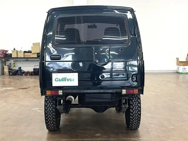スズキ ジムニー ワイルドウィンド LTD 道央・札幌 1993(平5)年 18.3万km ダーククラシックジェイドパール 5MT/リフトアップ/マッドタイヤ/　GEOLANDAR　M/T　G003/　2025年製　9mm/前後パイプバンパー/社外マフラー（車検対応）/社外ヘッドライトレンズ/社外ウインカーレンズ（前/横）/社外フロントグリル/社外ステアリング/社外シートカバー/ナンバー移動キット/社外オーディオ/　CD/AUX/USB/FM/AM