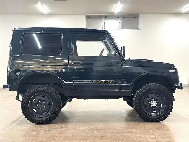 スズキ ジムニー ワイルドウィンド LTD 道央・札幌 1993(平5)年 18.3万km ダーククラシックジェイドパール 5MT/リフトアップ/マッドタイヤ/　GEOLANDAR　M/T　G003/　2025年製　9mm/前後パイプバンパー/社外マフラー（車検対応）/社外ヘッドライトレンズ/社外ウインカーレンズ（前/横）/社外フロントグリル/社外ステアリング/社外シートカバー/ナンバー移動キット/社外オーディオ/　CD/AUX/USB/FM/AM
