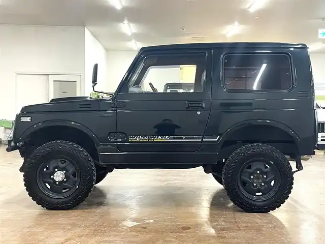 スズキ ジムニー ワイルドウィンド LTD 道央・札幌 1993(平5)年 18.3万km ダーククラシックジェイドパール 5MT/リフトアップ/マッドタイヤ/　GEOLANDAR　M/T　G003/　2025年製　9mm/前後パイプバンパー/社外マフラー（車検対応）/社外ヘッドライトレンズ/社外ウインカーレンズ（前/横）/社外フロントグリル/社外ステアリング/社外シートカバー/ナンバー移動キット/社外オーディオ/　CD/AUX/USB/FM/AM
