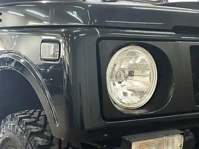 スズキ ジムニー ワイルドウィンド LTD 道央・札幌 1993(平5)年 18.3万km ダーククラシックジェイドパール 5MT/リフトアップ/マッドタイヤ/　GEOLANDAR　M/T　G003/　2025年製　9mm/前後パイプバンパー/社外マフラー（車検対応）/社外ヘッドライトレンズ/社外ウインカーレンズ（前/横）/社外フロントグリル/社外ステアリング/社外シートカバー/ナンバー移動キット/社外オーディオ/　CD/AUX/USB/FM/AM