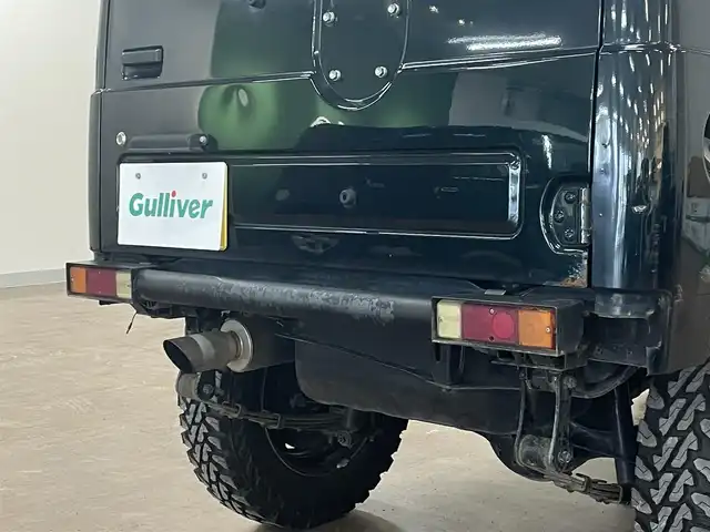 スズキ ジムニー ワイルドウィンド LTD 道央・札幌 1993(平5)年 18.3万km ダーククラシックジェイドパール 5MT/リフトアップ/マッドタイヤ/　GEOLANDAR　M/T　G003/　2025年製　9mm/前後パイプバンパー/社外マフラー（車検対応）/社外ヘッドライトレンズ/社外ウインカーレンズ（前/横）/社外フロントグリル/社外ステアリング/社外シートカバー/ナンバー移動キット/社外オーディオ/　CD/AUX/USB/FM/AM