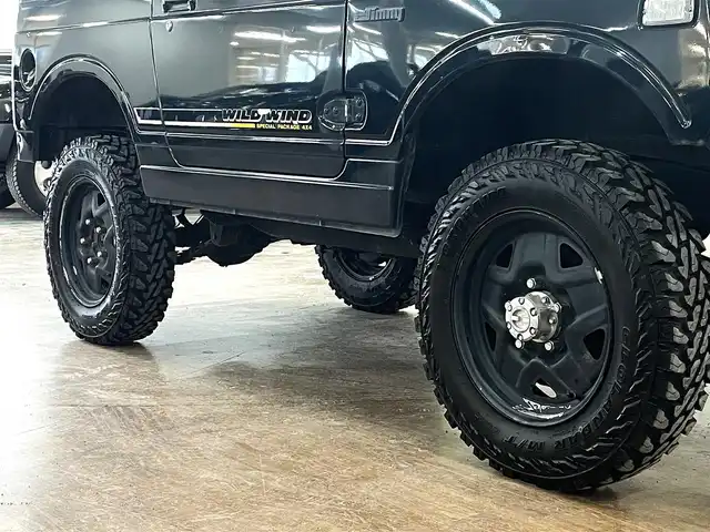 スズキ ジムニー ワイルドウィンド LTD 道央・札幌 1993(平5)年 18.3万km ダーククラシックジェイドパール 5MT/リフトアップ/マッドタイヤ/　GEOLANDAR　M/T　G003/　2025年製　9mm/前後パイプバンパー/社外マフラー（車検対応）/社外ヘッドライトレンズ/社外ウインカーレンズ（前/横）/社外フロントグリル/社外ステアリング/社外シートカバー/ナンバー移動キット/社外オーディオ/　CD/AUX/USB/FM/AM