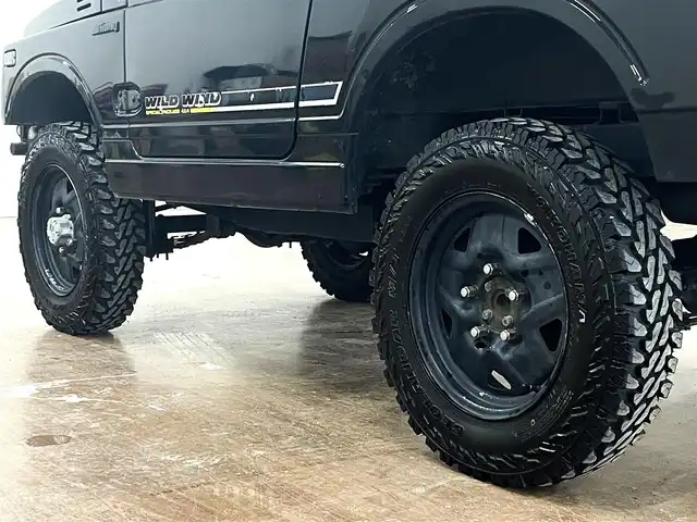 スズキ ジムニー ワイルドウィンド LTD 道央・札幌 1993(平5)年 18.3万km ダーククラシックジェイドパール 5MT/リフトアップ/マッドタイヤ/　GEOLANDAR　M/T　G003/　2025年製　9mm/前後パイプバンパー/社外マフラー（車検対応）/社外ヘッドライトレンズ/社外ウインカーレンズ（前/横）/社外フロントグリル/社外ステアリング/社外シートカバー/ナンバー移動キット/社外オーディオ/　CD/AUX/USB/FM/AM