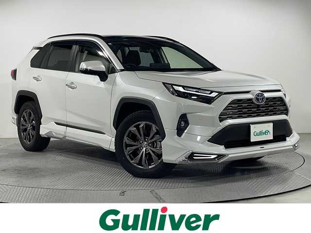 トヨタ ＲＡＶ４ ハイブリットG 広島県 2024(令6)年 2.1万km プラチナホワイトパールマイカ パノラマムーンルーフ/モデリスタフルエアロ/純正10.5型ディスプレイオーディオ（AppleCarPlay/AndroidAuto/フルセグTV）/パノラミックビューモニター/ブラック合皮シート/パワーシート/シートヒーター/ベンチレーション/パワーバックドア/ステアリングヒーター/ブラインドスポットモニター/クリアランスソナー/パーキングサポートブレーキ/セーフティセンス/・プリクラッシュセーフティ/・レーントレーシングアシスト/・オートマチックハイビーム/・レーダークルーズコントロール/LEDヘッドランプ/純正18インチAW/ETC2.0/USB入力端子