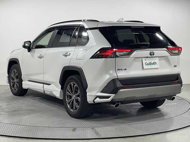 トヨタ ＲＡＶ４ ハイブリットG 広島県 2024(令6)年 2.1万km プラチナホワイトパールマイカ パノラマムーンルーフ/モデリスタフルエアロ/純正10.5型ディスプレイオーディオ（AppleCarPlay/AndroidAuto/フルセグTV）/パノラミックビューモニター/ブラック合皮シート/パワーシート/シートヒーター/ベンチレーション/パワーバックドア/ステアリングヒーター/ブラインドスポットモニター/クリアランスソナー/パーキングサポートブレーキ/セーフティセンス/・プリクラッシュセーフティ/・レーントレーシングアシスト/・オートマチックハイビーム/・レーダークルーズコントロール/LEDヘッドランプ/純正18インチAW/ETC2.0/USB入力端子