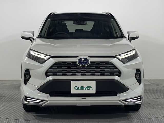 トヨタ ＲＡＶ４ ハイブリットG 広島県 2024(令6)年 2.1万km プラチナホワイトパールマイカ パノラマムーンルーフ/モデリスタフルエアロ/純正10.5型ディスプレイオーディオ（AppleCarPlay/AndroidAuto/フルセグTV）/パノラミックビューモニター/ブラック合皮シート/パワーシート/シートヒーター/ベンチレーション/パワーバックドア/ステアリングヒーター/ブラインドスポットモニター/クリアランスソナー/パーキングサポートブレーキ/セーフティセンス/・プリクラッシュセーフティ/・レーントレーシングアシスト/・オートマチックハイビーム/・レーダークルーズコントロール/LEDヘッドランプ/純正18インチAW/ETC2.0/USB入力端子