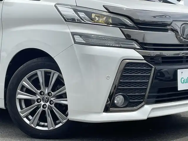 トヨタ ヴェルファイア Z Aエディション 佐賀県 2016(平28)年 6.7万km 白 レーダークルーズコントロール/クリアランスソナー/衝突被害軽減ブレーキ/純正９インチメモリナビ/フルセグTV　CD　DVD　SD　BT/バックカメラ/後席用フリップダウンモニター/ビルトインETC2.0/両側パワースライドドア/パワーバックドア/電子パーキングブレーキ/ブレーキホールド機能/キャプテンシート/オットマン/ISOFIX/ステアリングリモコン/純正18インチアルミホイール/純正LEDヘッドライト/フォグライト/ウィンカーミラー/ドアバイザ―/プッシュスタート/スマートキー