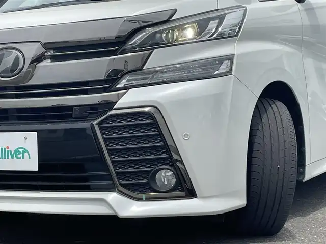 トヨタ ヴェルファイア Z Aエディション 佐賀県 2016(平28)年 6.7万km 白 レーダークルーズコントロール/クリアランスソナー/衝突被害軽減ブレーキ/純正９インチメモリナビ/フルセグTV　CD　DVD　SD　BT/バックカメラ/後席用フリップダウンモニター/ビルトインETC2.0/両側パワースライドドア/パワーバックドア/電子パーキングブレーキ/ブレーキホールド機能/キャプテンシート/オットマン/ISOFIX/ステアリングリモコン/純正18インチアルミホイール/純正LEDヘッドライト/フォグライト/ウィンカーミラー/ドアバイザ―/プッシュスタート/スマートキー