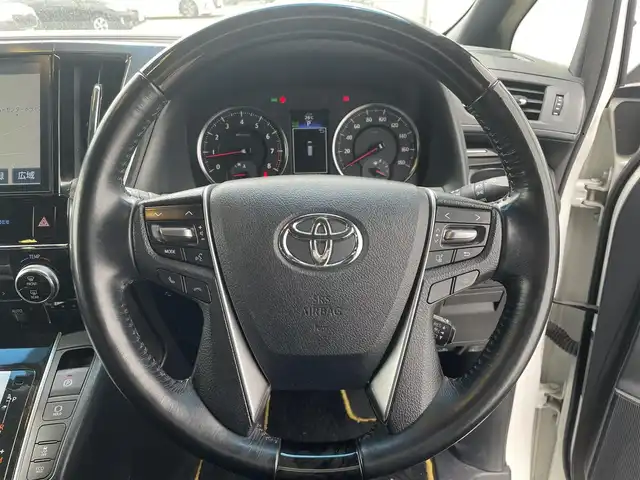 トヨタ ヴェルファイア Z Aエディション 佐賀県 2016(平28)年 6.7万km 白 レーダークルーズコントロール/クリアランスソナー/衝突被害軽減ブレーキ/純正９インチメモリナビ/フルセグTV　CD　DVD　SD　BT/バックカメラ/後席用フリップダウンモニター/ビルトインETC2.0/両側パワースライドドア/パワーバックドア/電子パーキングブレーキ/ブレーキホールド機能/キャプテンシート/オットマン/ISOFIX/ステアリングリモコン/純正18インチアルミホイール/純正LEDヘッドライト/フォグライト/ウィンカーミラー/ドアバイザ―/プッシュスタート/スマートキー