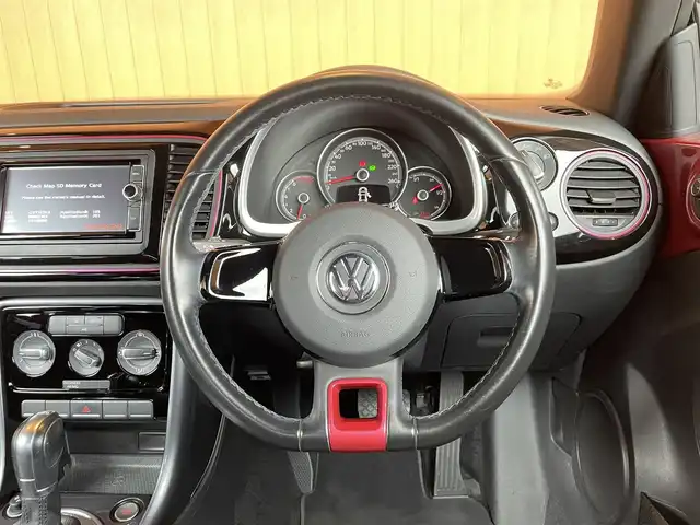 フォルクスワーゲン ザ・ビートル ハッシュタグピンクビートル 愛知県 2016(平28)年 4.9万km ピンク スマートエントリー /プッシュスタート /純正ナビ /バックカメラ/フルセグTV /Bluetooth /リアスポイラー /HIDヘッドライト　/ＭＴモード付ＡＴ　/クルーズコントロール　/ＥＴＣ/ドラレコ/スマートキー