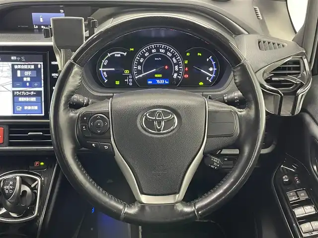 トヨタ エスクァイア ハイブリッド Gi プレミアムパッケージ ブラックテーラード 愛知県 2020(令2)年 7.6万km ブラック 純正１０型ナビ　純正１２．１型後席モニター　純正エアロ　ナビ連動前後ドラレコ　ハーフレザー　シートヒーター　ＡＣ１００Ｖ電源　バックカメラ　セーフティセンス　衝突軽減　ＬＥＤオートライト　コーナーセンサー　禁煙車