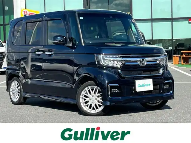 ホンダ Ｎ ＢＯＸ カスタム L ターボ 奈良県 2021(令3)年 1.8万km ミッドナイトブルービームM 純正8インチナビ(VXU-217NBi)/（フルセグ/BT/CD/DVD)/レーダークルーズコントロール/バックカメラ/パドルシフト/後方コーナーセンサー/衝突軽減システム/レーンキープアシスト/両側パワースライドドア/ハーフレザーシート/前席シートヒーター/後席サンシェード/前後ドライブレコーダー/ETC/LEDヘッドライト/純正15インチAW/保証書/取り扱い説明書