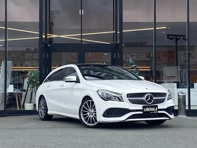 メルセデス・ベンツ ＣＬＡ１８０ Sブレイク AMG スタイル 福岡県 2018(平30)年 2.1万km ポーラホワイト ・サンルーフ/・クルーズコントロール/・純正ＨＤＤナビ／ＵＳＢ／Ｂｌｕｅｔｏｏｔｈ／ｉＰｏｄ／ＣＤ/・バックカメラ/・ハーフレザーシート／シートヒーター/・フルセグ/・ＥＴＣ/・純正１８ＡＷ/・パーキングアシスト/・アイドリングストップ/・パワーシート/・レーンキープアシスト/・オートライト/・LEDライト/・パドルシフト/・保証書/・取扱説明書