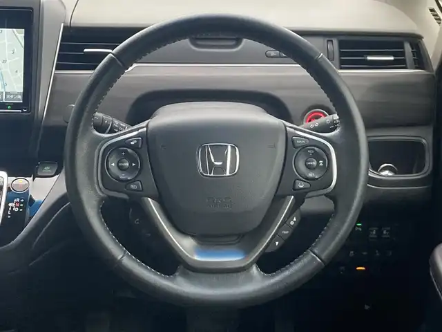 ホンダ フリード ハイブリット G ホンダセンシング 島根県 2021(令3)年 7.8万km プラチナホワイトパール ワンオーナー /ディーラーOP9インチナビ(CD/DVD/BT/フルセグ)/両側パワースライドドア /衝突被害権限ブレーキ/先行車発進告知/路外逸脱抑制システム/レーンキープアシスト/標識認識/アダクティブクルーズコントロール/オートライト/LEDヘッドライト/前席シートヒーター /ビルトインETC/前後ドライブレコーダー/純正フロアマット/取扱説明書/保証書/スペアキー×1
