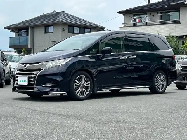 ホンダ オデッセイ アブソルート ホンダセンシング 静岡県 2017(平29)年 6.9万km 黒 エンジンスタートボタン/パワーステアリング/パワーウィンドウ/パドルシフト/アイドリングストップ/スマートキー/Wオートエアコン/クルーズコントロール追従走行/Bluetooth/CD/CDチェンジャー/USB入力端子/ETC2.0/バックカメラ/TV/メモリナビ/3列シート/オットマン/純正前方ドラレコ/ウォークスルー/純正フロアマット/D席パワーシート/布シート/両側パワースライドドア/純正サイドエアロパーツ/純正アルミホイール/ABS/横滑り防止装置/レーンキープアシスト/オートライト/W＋サイドエアバッグ/衝突軽減システム/カーテンエアバック