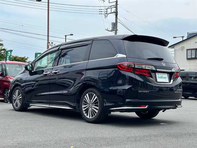 ホンダ オデッセイ アブソルート ホンダセンシング 静岡県 2017(平29)年 6.9万km 黒 エンジンスタートボタン/パワーステアリング/パワーウィンドウ/パドルシフト/アイドリングストップ/スマートキー/Wオートエアコン/クルーズコントロール追従走行/Bluetooth/CD/CDチェンジャー/USB入力端子/ETC2.0/バックカメラ/TV/メモリナビ/3列シート/オットマン/純正前方ドラレコ/ウォークスルー/純正フロアマット/D席パワーシート/布シート/両側パワースライドドア/純正サイドエアロパーツ/純正アルミホイール/ABS/横滑り防止装置/レーンキープアシスト/オートライト/W＋サイドエアバッグ/衝突軽減システム/カーテンエアバック