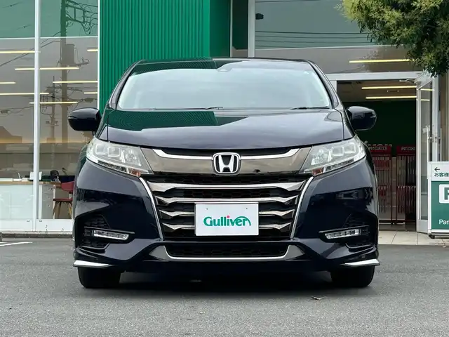 ホンダ オデッセイ アブソルート ホンダセンシング 静岡県 2017(平29)年 6.9万km 黒 エンジンスタートボタン/パワーステアリング/パワーウィンドウ/パドルシフト/アイドリングストップ/スマートキー/Wオートエアコン/クルーズコントロール追従走行/Bluetooth/CD/CDチェンジャー/USB入力端子/ETC2.0/バックカメラ/TV/メモリナビ/3列シート/オットマン/純正前方ドラレコ/ウォークスルー/純正フロアマット/D席パワーシート/布シート/両側パワースライドドア/純正サイドエアロパーツ/純正アルミホイール/ABS/横滑り防止装置/レーンキープアシスト/オートライト/W＋サイドエアバッグ/衝突軽減システム/カーテンエアバック