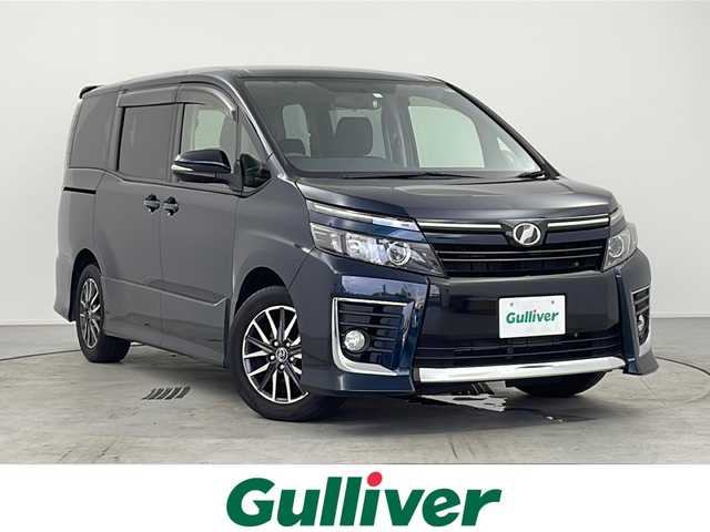 トヨタ ヴォクシー ZS 愛知県 2015(平27)年 5.3万km ブラッキッシュアゲハガラスフレーク /禁煙車//ワンオーナー車//純正ナビ//フルセグTV//バックカメラ//ビルトインETC//社外前方ドライブレコーダー//LEDヘッドライト//オートライト//左側パワースライドドア//後席サンシェード//純正16インチアルミホイール//純正フロアマット//純正ドアバイザー//革巻きステアリング//ステアリングスイッチ//プッシュスタート//電動格納ミラーウィンカー//アイドリングストップ//新車保証書・取扱説明書//スペアキー