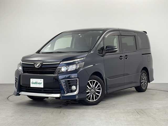 トヨタ ヴォクシー ZS 愛知県 2015(平27)年 5.3万km ブラッキッシュアゲハガラスフレーク /禁煙車//ワンオーナー車//純正ナビ//フルセグTV//バックカメラ//ビルトインETC//社外前方ドライブレコーダー//LEDヘッドライト//オートライト//左側パワースライドドア//後席サンシェード//純正16インチアルミホイール//純正フロアマット//純正ドアバイザー//革巻きステアリング//ステアリングスイッチ//プッシュスタート//電動格納ミラーウィンカー//アイドリングストップ//新車保証書・取扱説明書//スペアキー