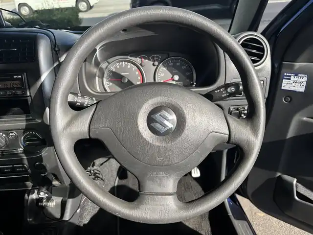 スズキ ジムニー XC 愛知県 2010(平22)年 9.3万km ノクターンブルーパール 4WD/5速MT/ETC/ポータブルナビ/カーオーディオFM/AM/純正アルミホイール/純正フロアマット/背面タイヤ/ルーフレール/パワーウインドウ/パワーステアリング/スペアキー/ABS