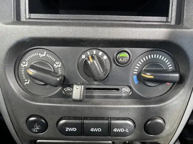 スズキ ジムニー XC 愛知県 2010(平22)年 9.3万km ノクターンブルーパール 4WD/5速MT/ETC/ポータブルナビ/カーオーディオFM/AM/純正アルミホイール/純正フロアマット/背面タイヤ/ルーフレール/パワーウインドウ/パワーステアリング/スペアキー/ABS